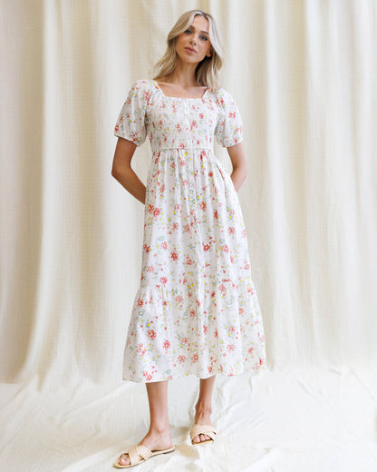 Downeast High Tea Dress in floral print, lightweight fabric, with a fitted bodice and flowing skirt, perfect for elegant occasions.