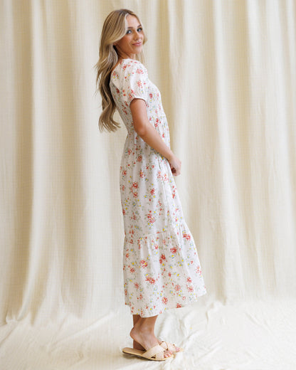 Downeast High Tea Dress showing a floral-patterned, elegant dress with a fitted waist and flowy skirt, perfect for formal occasions.