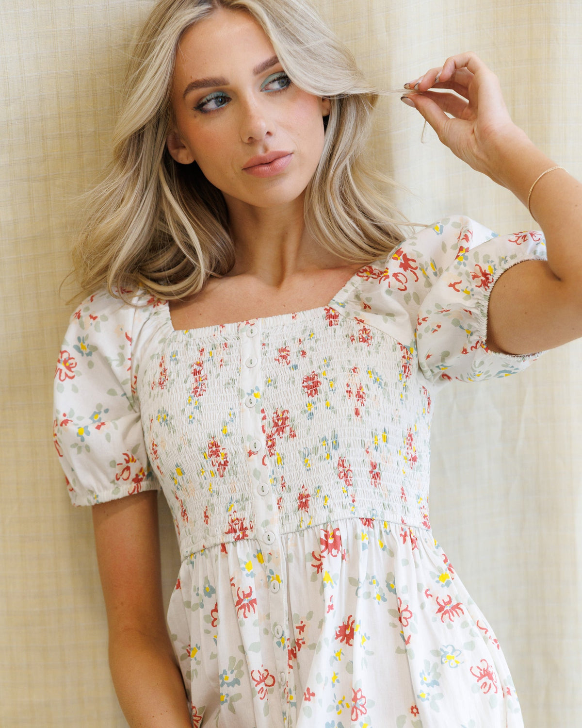 Downeast high tea dress featuring a floral pattern, sleeveless design, and elegant fit for sophisticated occasions.