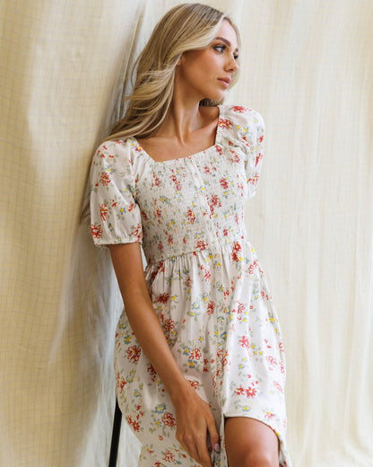 Downeast high tea dress with floral pattern, sleeveless design, and fitted waist, ideal for elegant occasions.