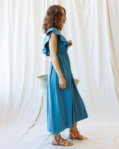 Downeast Sol Mate Dress featuring a flowy, bohemian style with floral patterns and lightweight fabric, perfect for casual wear.