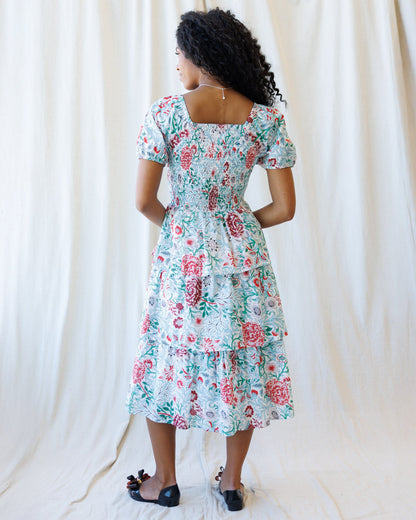 Downeast Complimentary Colors Dress showing a flowy, multi-colored dress with a fitted waist and short sleeves.