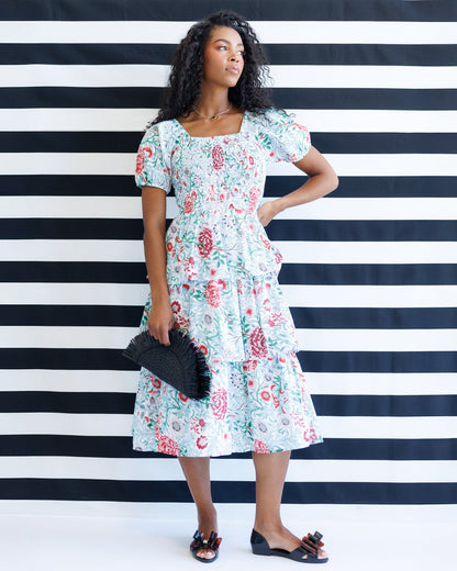 Downeast complimentary colors dress, sleeveless summer dress with vibrant floral pattern, lightweight fabric, and flowy silhouette.