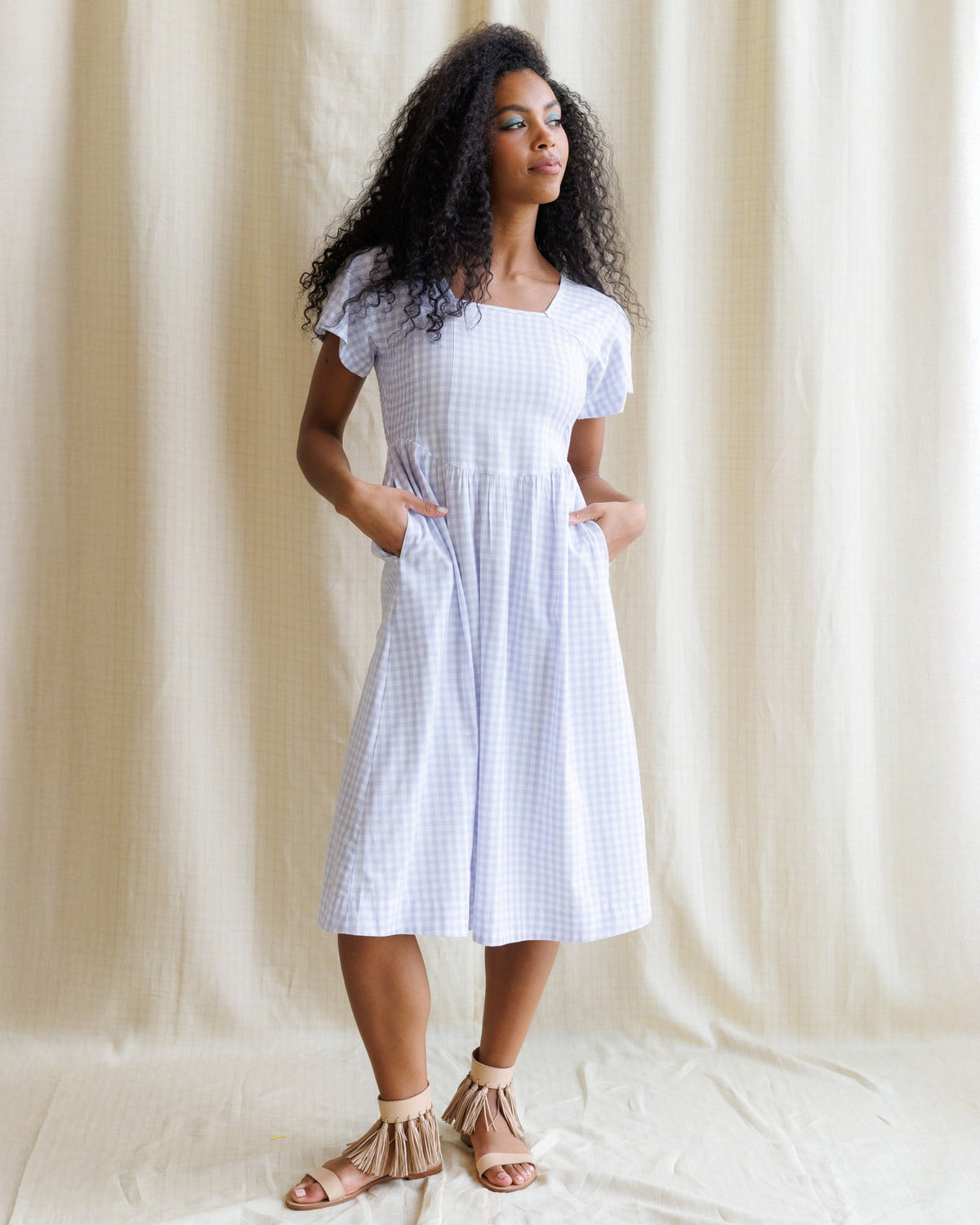Downeast Countryside Dress with floral pattern, sleeveless style, and lightweight fabric shown on a hanger.