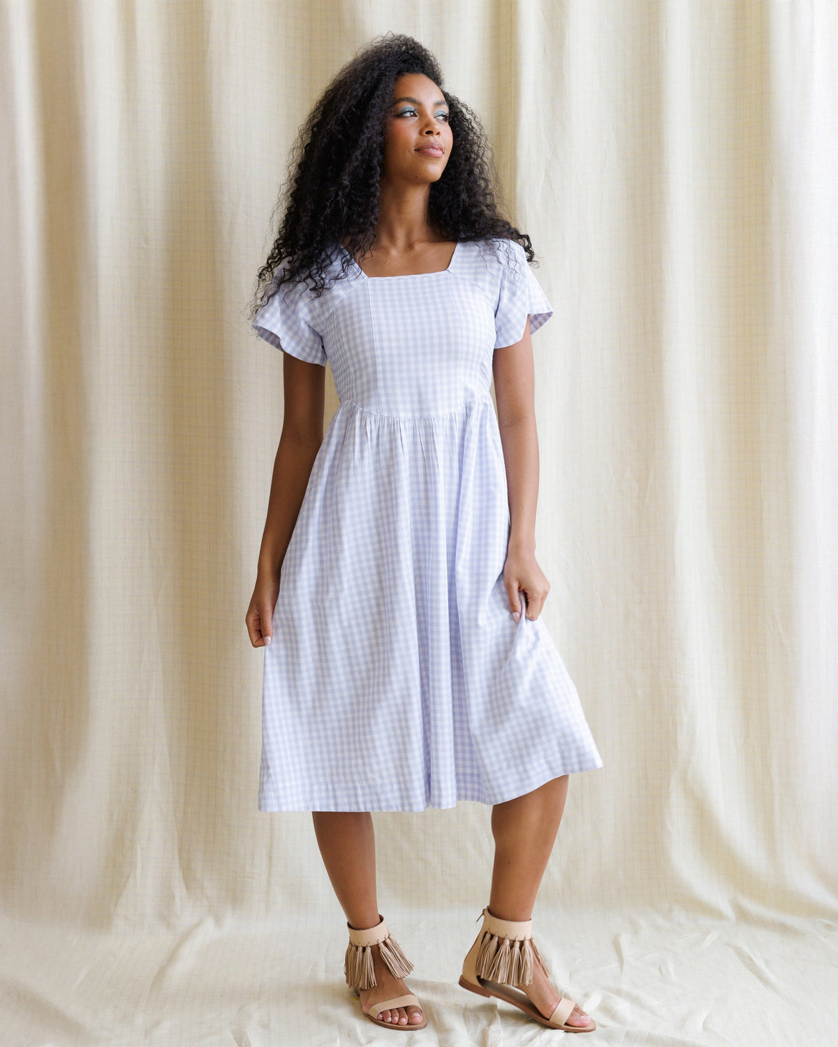 Downeast Countryside Dress displayed on a hanger with floral and pastel patterns, perfect for casual and summer wear.
