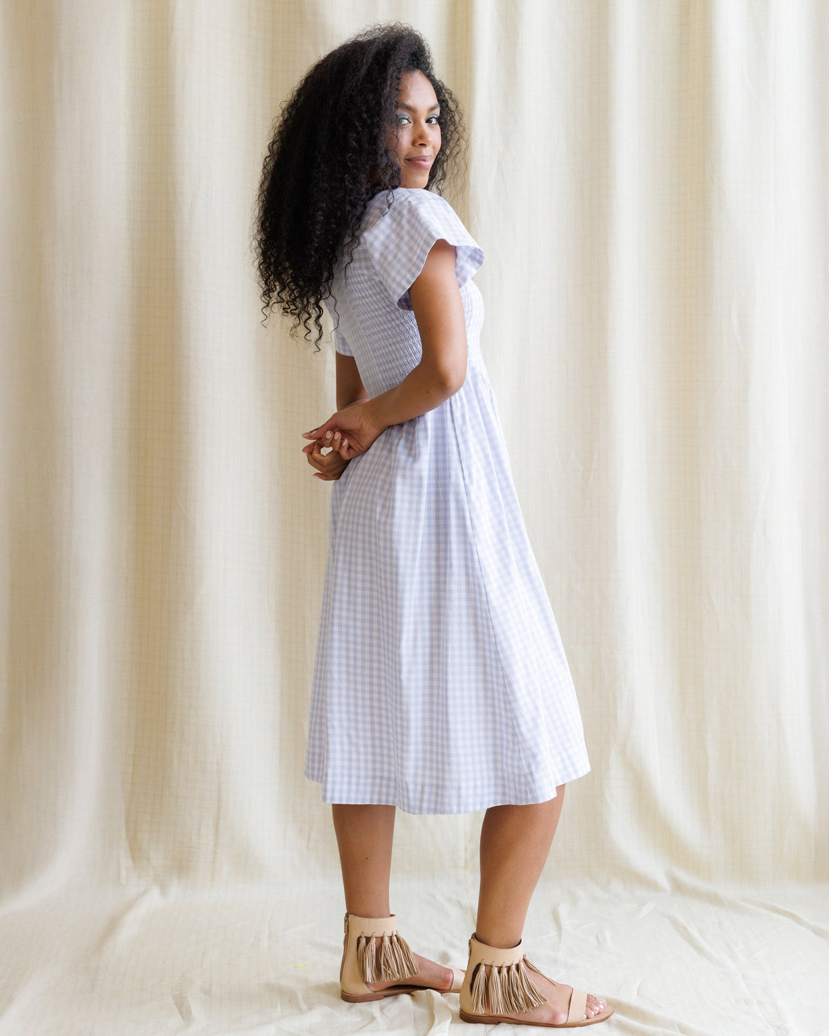 Downeast Countryside Dress shown in soft fabric with floral pattern, short sleeves, and a flowy silhouette.