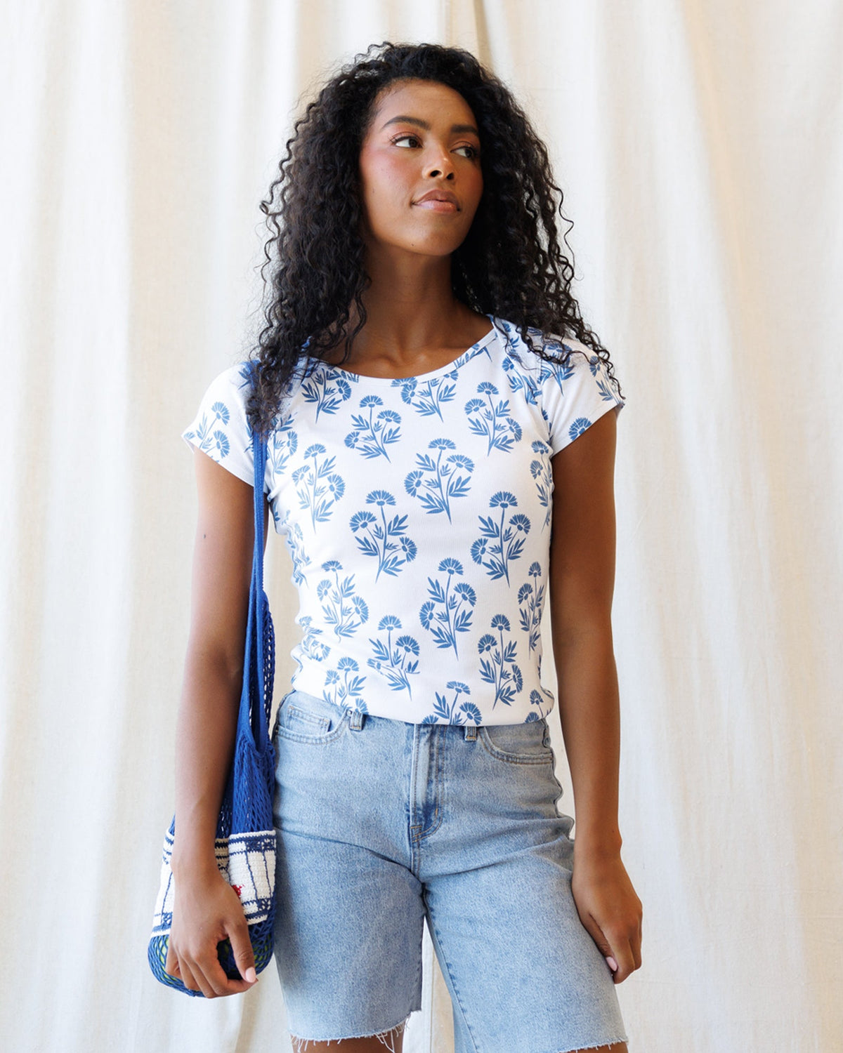 Downeast Artistic Tee featuring vibrant, abstract design on a casual top, showcasing colorful artwork on soft fabric.