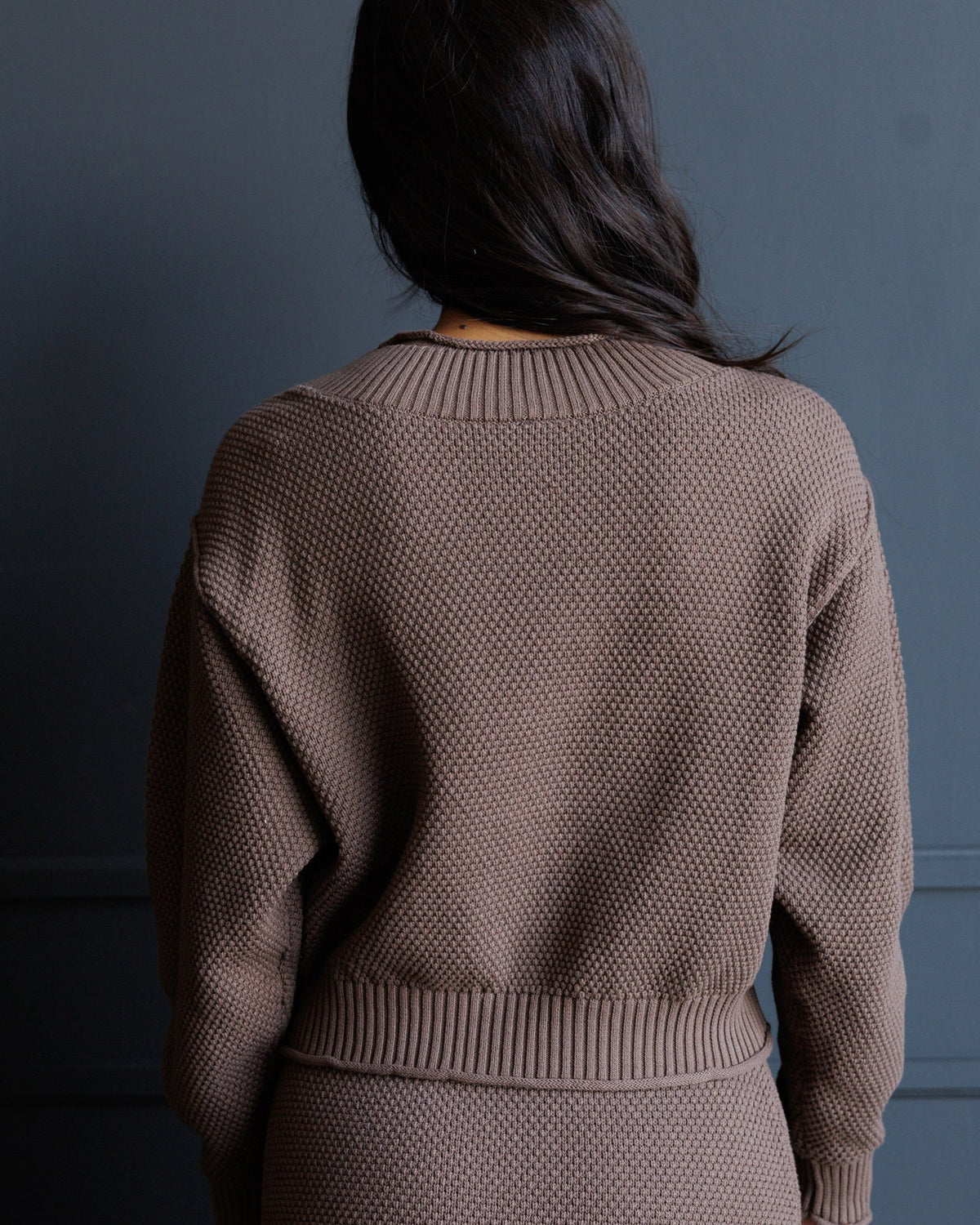 Downeast Carpe Diem sweater in soft knit fabric, featuring a stylish design and comfortable fit, shown on a model.