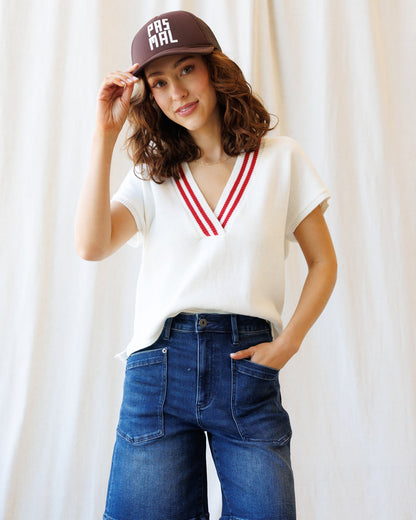 Downeast Atlantic vest sweater in neutral knit fabric, featuring a classic design and ribbed collar.