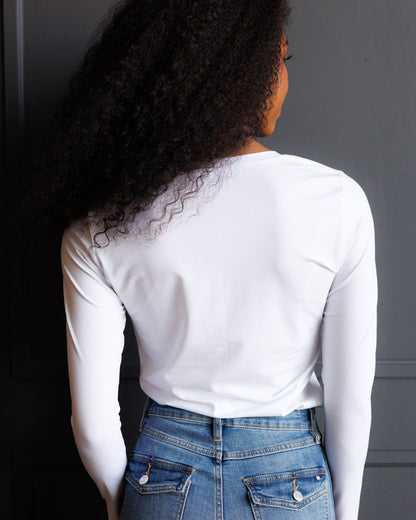 Downeast essential long sleeve tee in soft fabric, shown in a natural pose, featuring a classic fit and simple design.