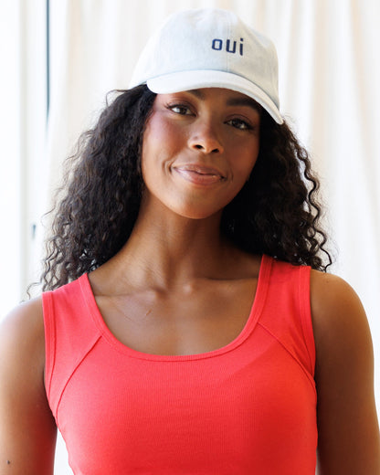Downeast Say Oui hat, stylish beige hat with embroidered "Say Oui" text, casual accessory for sunny days.