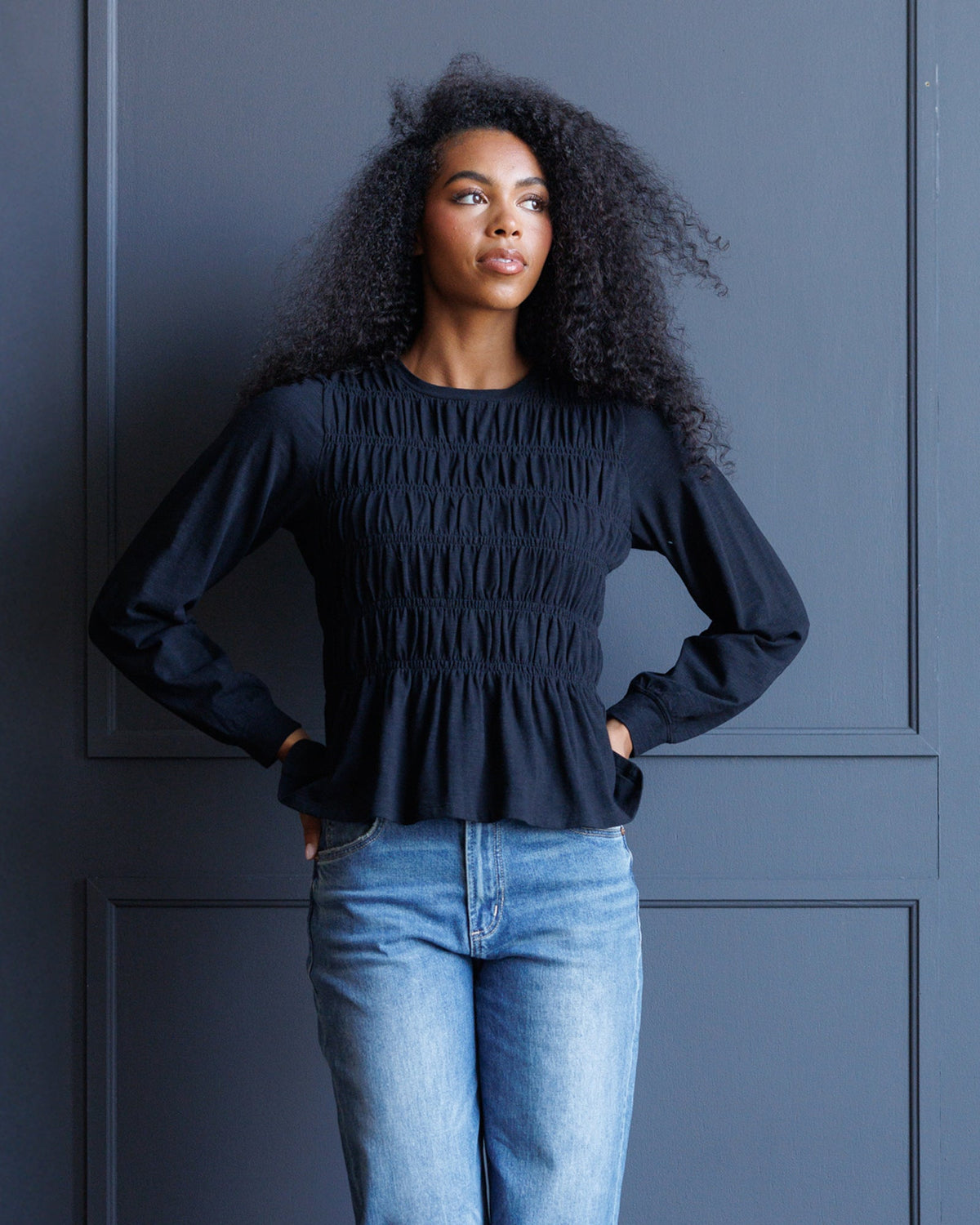 Downeast long sleeve smocked tee in soft fabric, featuring a fitted silhouette and gathered detailing on the sleeves.