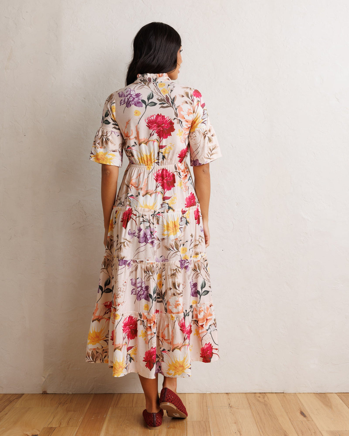 Downeast Mcintosh maxi dress with floral pattern, flowing fabric, sleeveless design, and V-neck neckline.