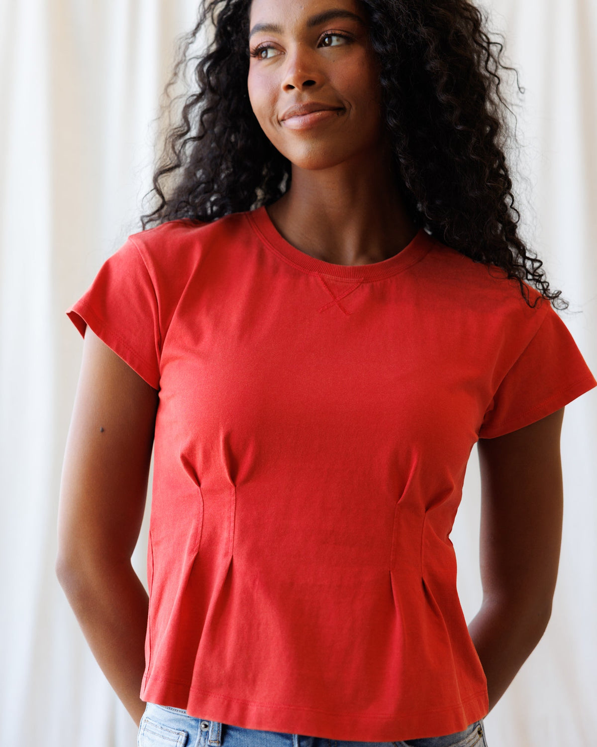 Downeast Pretty Sporty Tee, a casual women's sports top with a comfortable fit and stylish design, shown on a model.