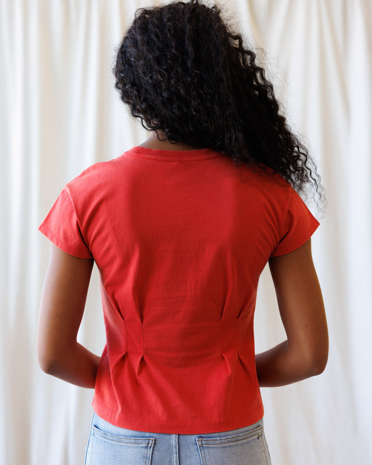 Downeast Pretty Sporty Tee, casual women's tops in soft fabric with a relaxed fit, displayed on a hanger.