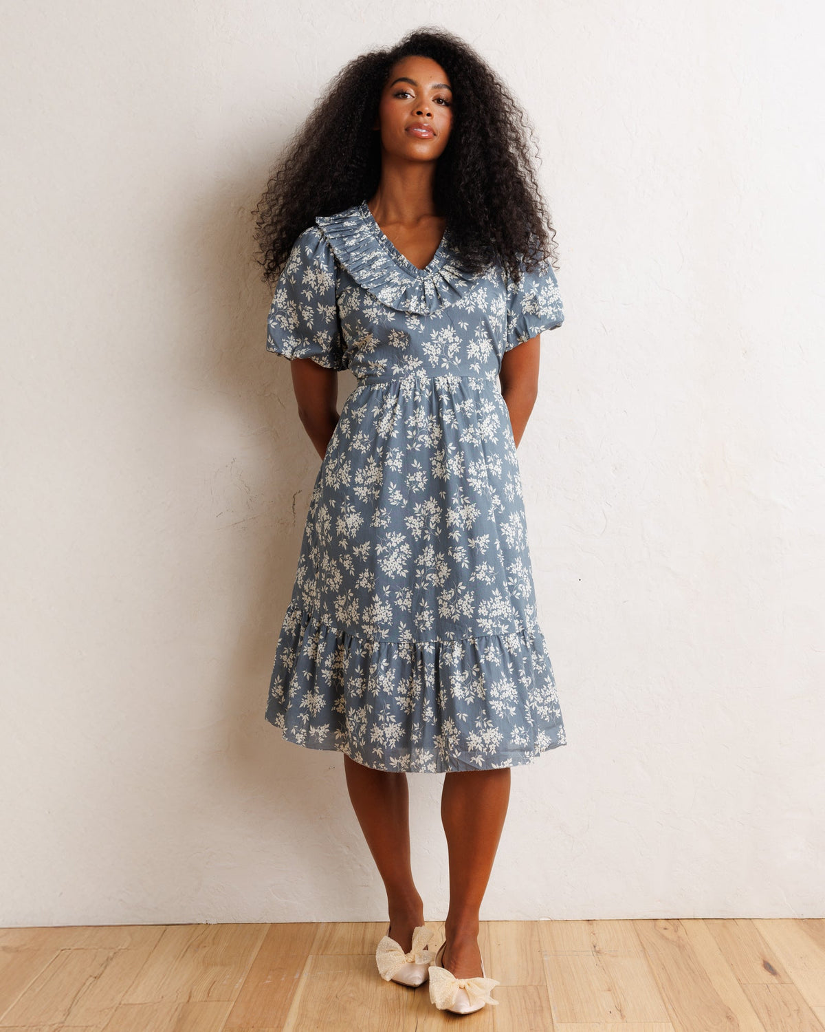 Downeast Heritage Beauty Dress featuring a floral pattern, fitted bodice, and flowing skirt, perfect for casual or semi-formal occasions.