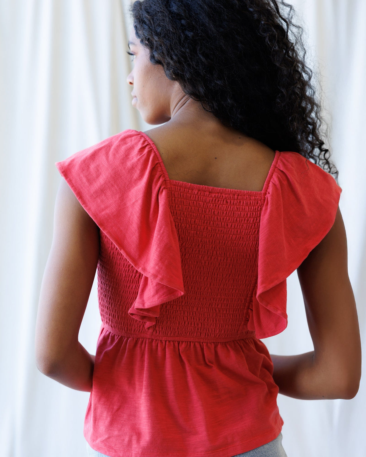 Downeast Sol Mate top, stylish and comfortable women’s casual top in soft fabric, displayed on a hanger.