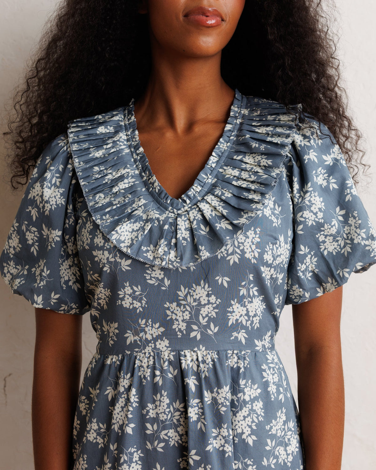 Downeast Heritage Beauty dress in a floral pattern, featuring a fitted bodice and flowing skirt for elegant style.
