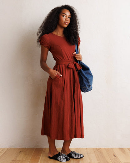 Downeast Sugar & Spice dress featuring a floral pattern, sleeveless design, and a fitted waist on a hanger.