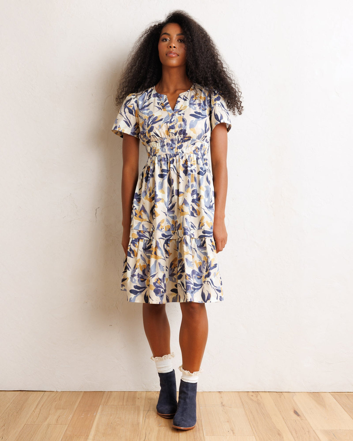 Downeast Icon Demi Dress in soft fabric with a fitted bodice and flowing skirt, displayed on a hanger against a neutral background.