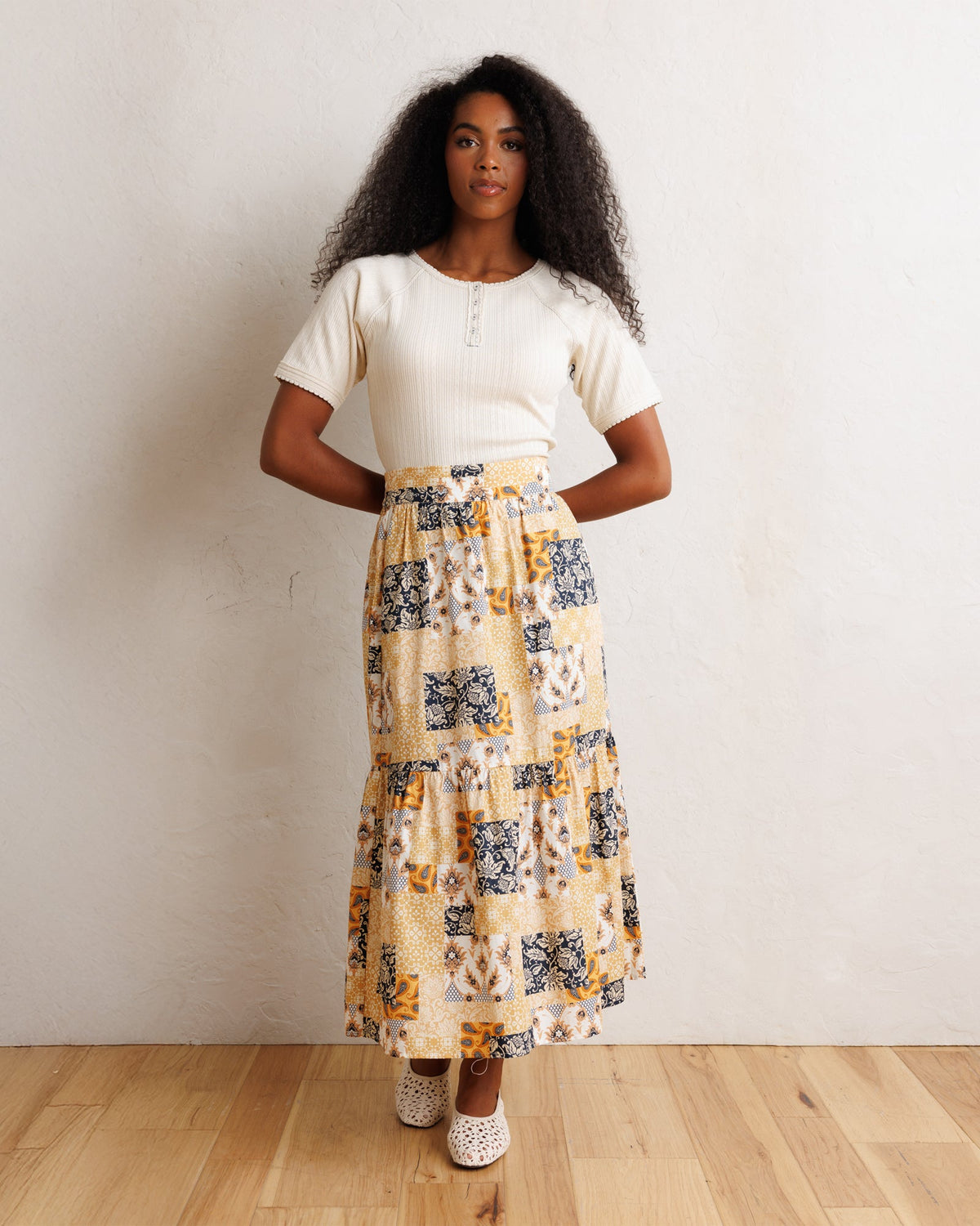 Downeast Pointelle Pretty Top featuring delicate knit fabric and a feminine design, displayed on a hanger.