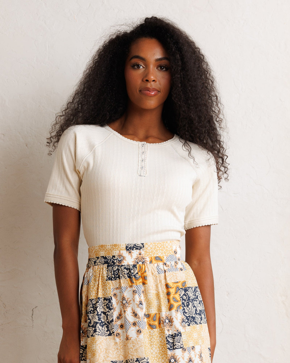 Downeast Pointelle Pretty Top shown on a hanger with delicate knit detailing and soft fabric, stylish and feminine women’s top.