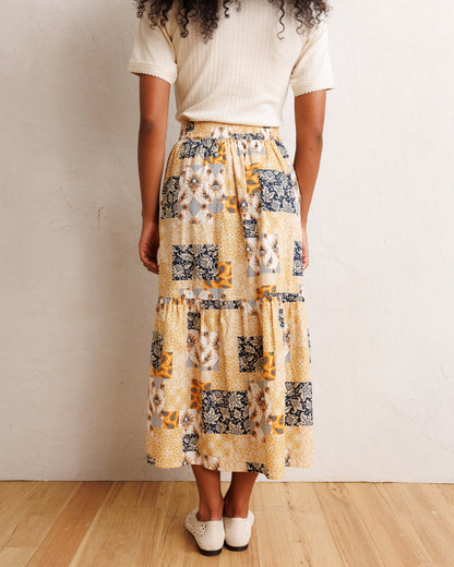Downeast heirloom skirt with floral pattern, high-waisted design, and flowing fabric for a vintage-inspired look.