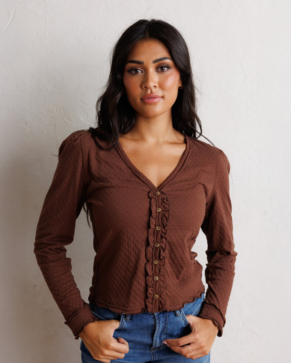 Downeast Carry On Cardi tops, lightweight knit cardigan in neutral color, shown on a hanger.
