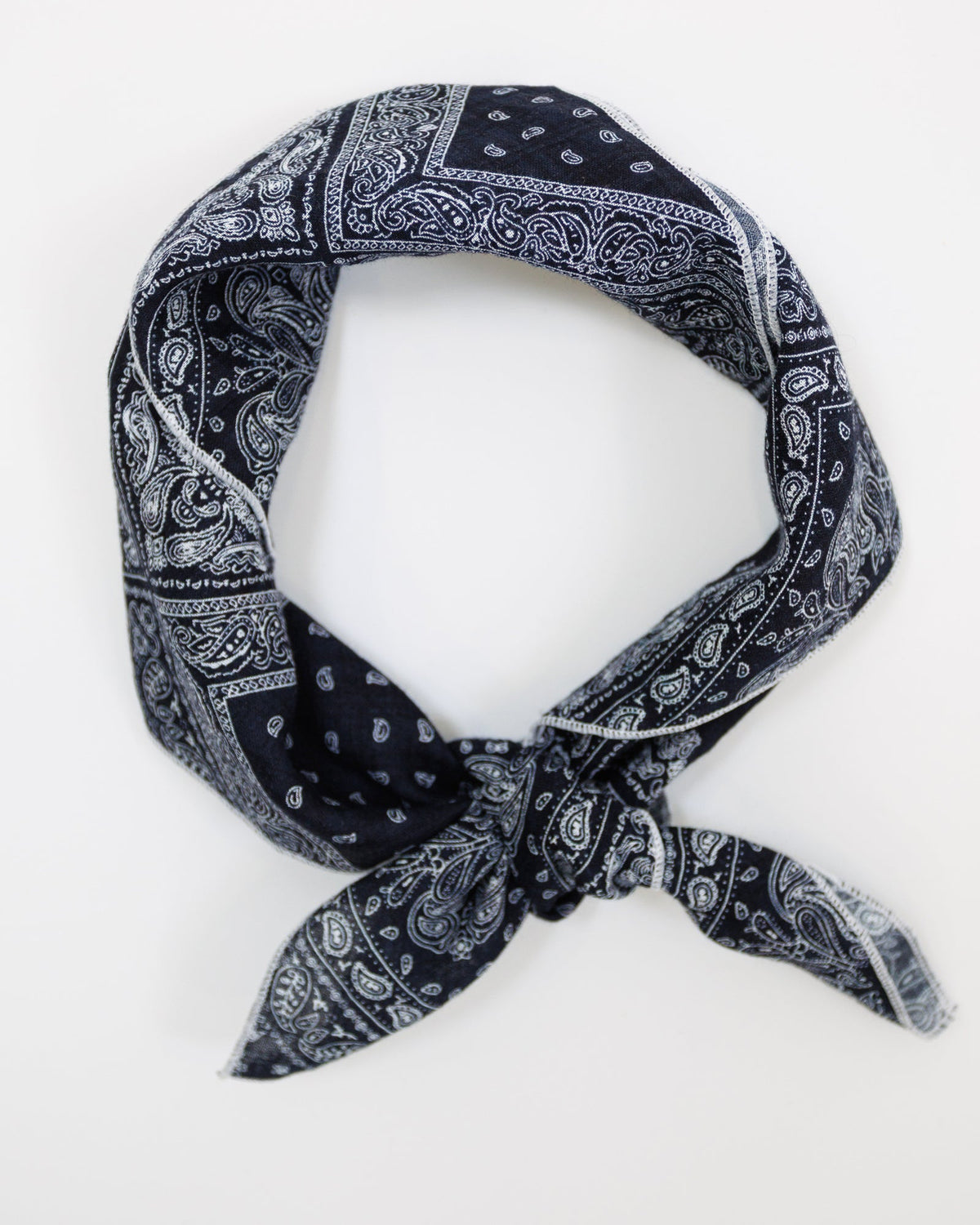 Downeast The Daily Scarf featuring soft fabric in a versatile design, styled around the neck with a casual, cozy look.