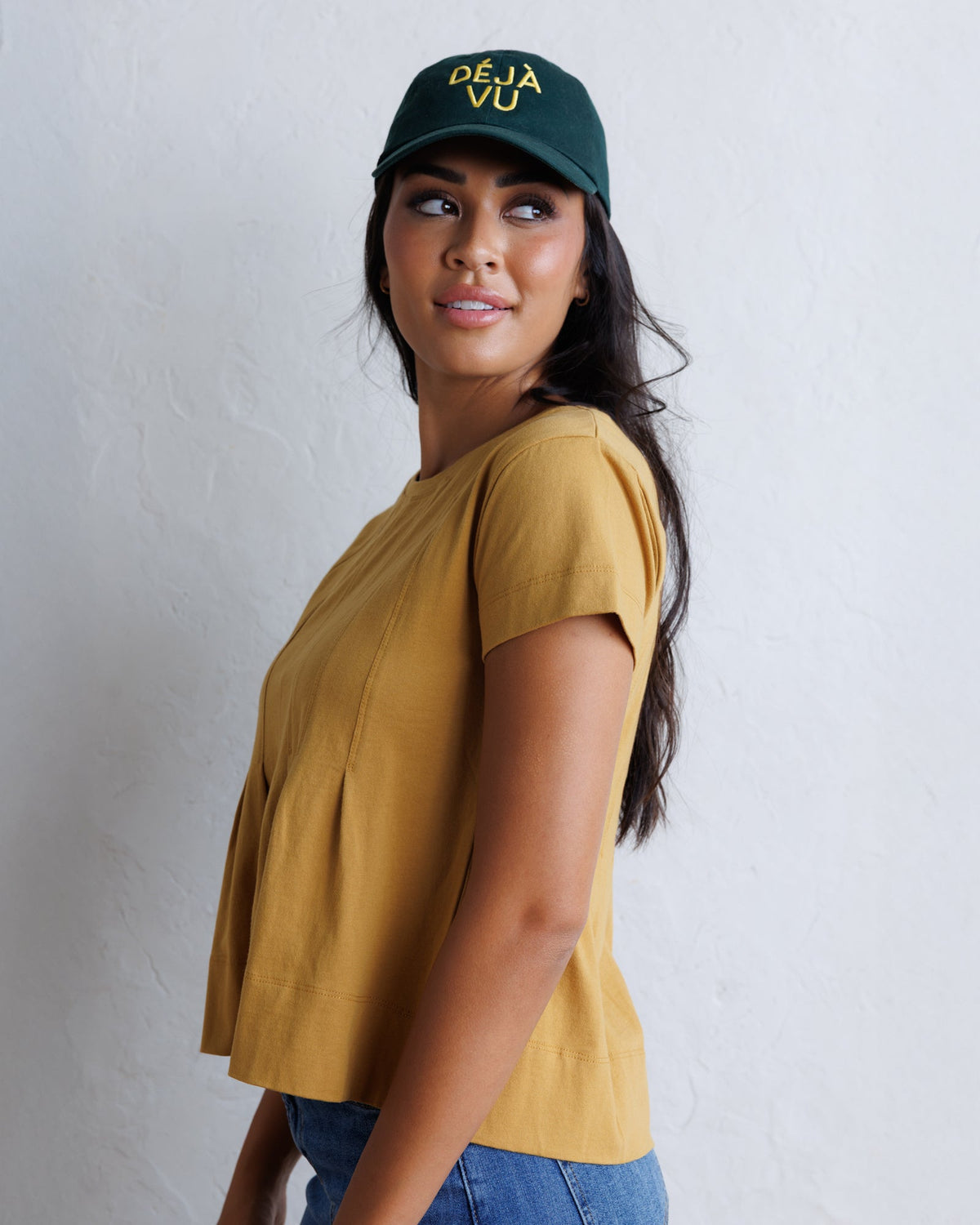 Downeast Portland Peplum Top in soft fabric with a fitted waist and stylish peplum hem, shown on a mannequin.