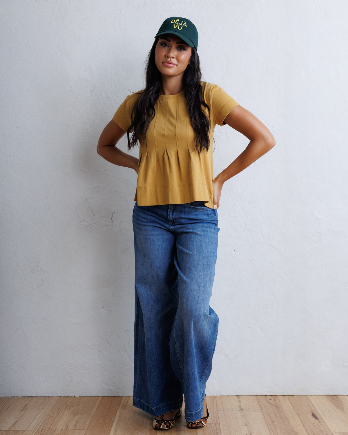Downeast super high wide leg slouchy wash denim jeans displayed on a hanger, showcasing relaxed fit and light wash finish.
