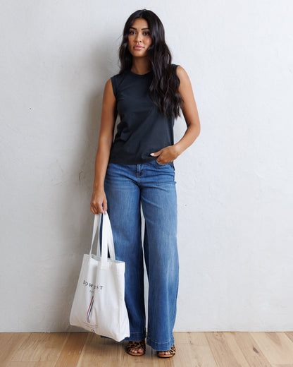 Downeast Super High Wide Leg Slouchy Wash denim jeans shown on a model, highlighting relaxed fit and stylish wide-leg design.