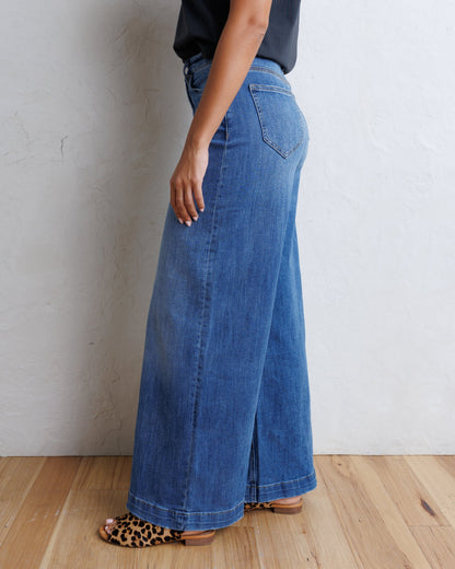Downeast super high wide leg slouchy denim jeans with a washed finish, shown on a model.