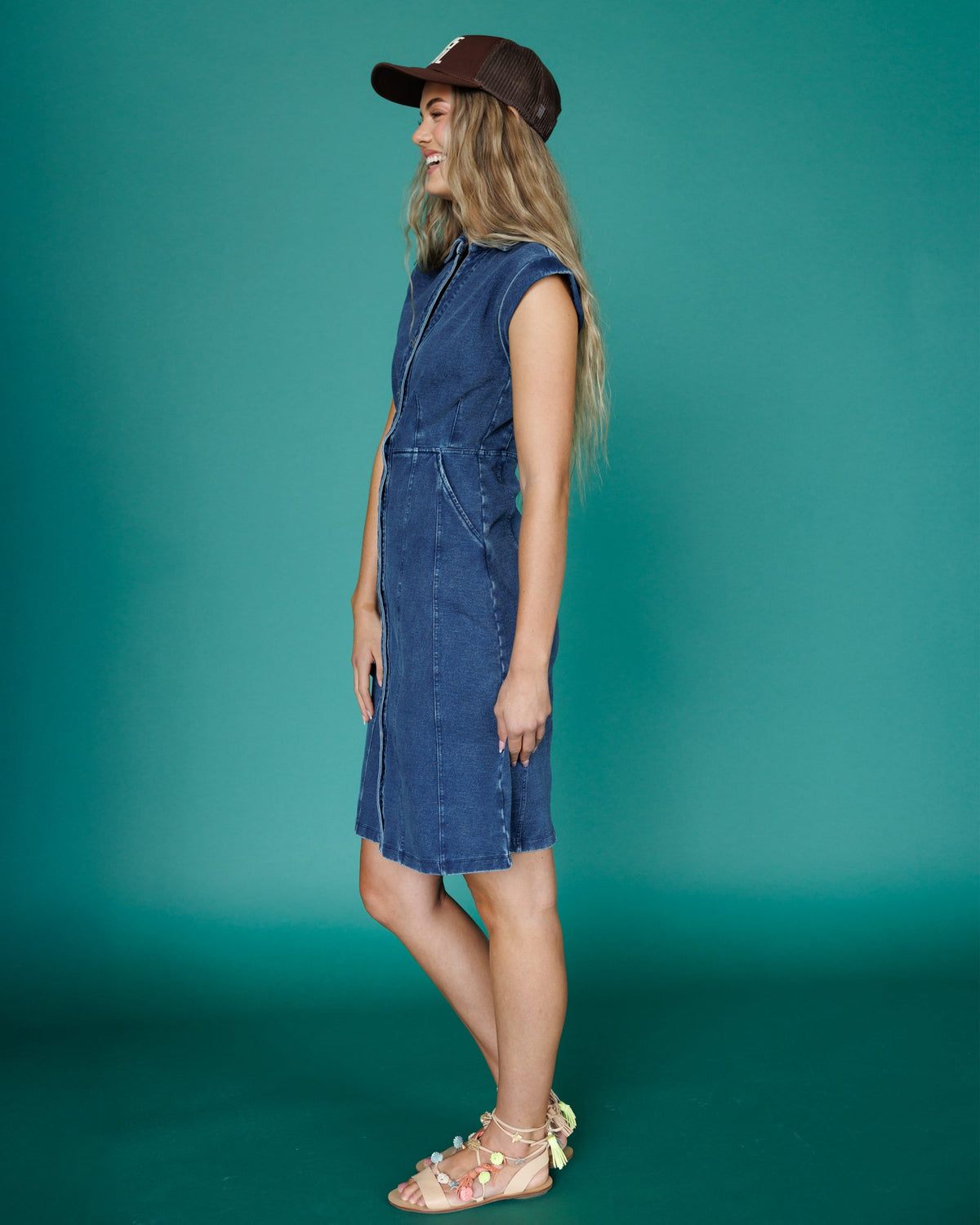 Downeast Brocante dress displayed on a hanger with floral patterns and flowing fabric, perfect for casual or summer wear.