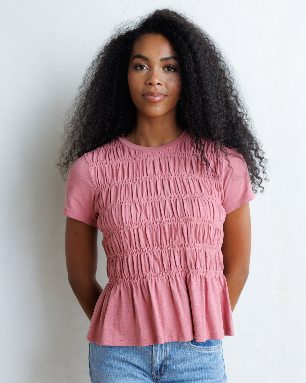 Downeast smocked tee top with a fitted, stretchy bodice and short sleeves, featuring a stylish smocked design.