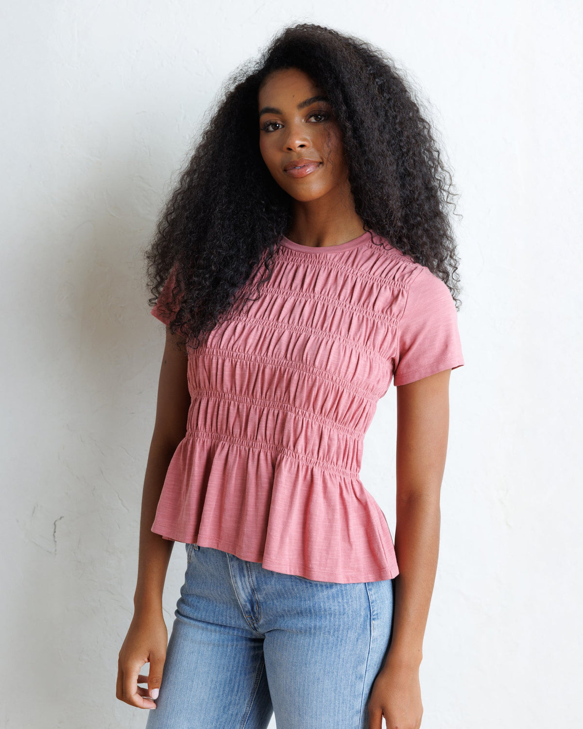 Downeast smocked tee top featuring a fitted, stylish design with smocked detailing and short sleeves, perfect for casual wear.