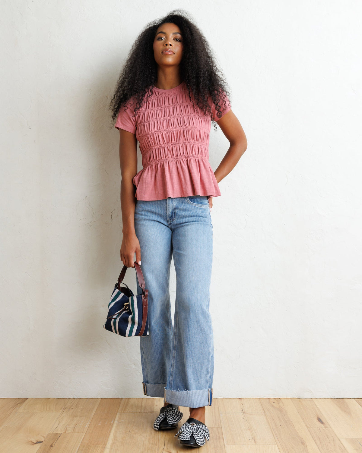 Downeast smocked tee featuring a relaxed fit and short sleeves, styled with casual fabric and detailed smocking at the neckline.