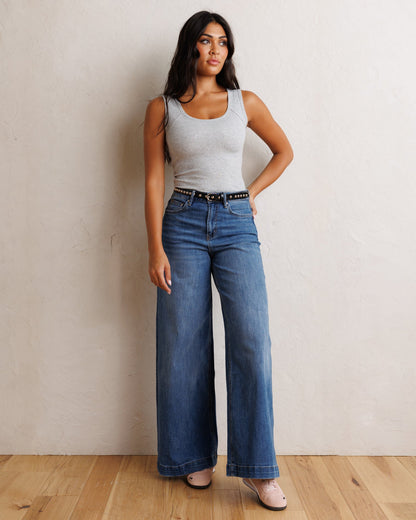 Downeast super high wide leg slouchy denim jeans, front view showing relaxed fit and washed blue fabric.