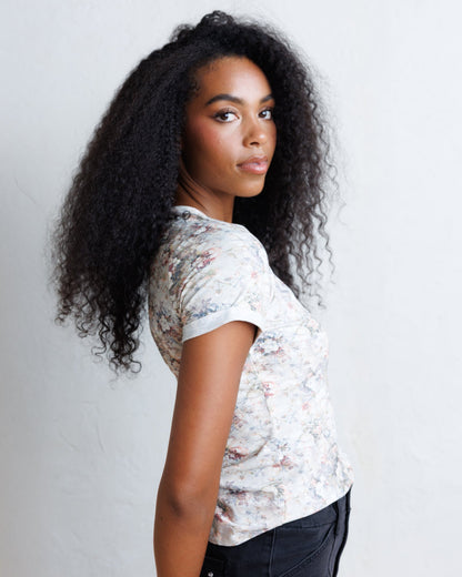 Downeast Go Floral Tee, a casual women's top with a floral pattern and short sleeves, displayed on a hanger.