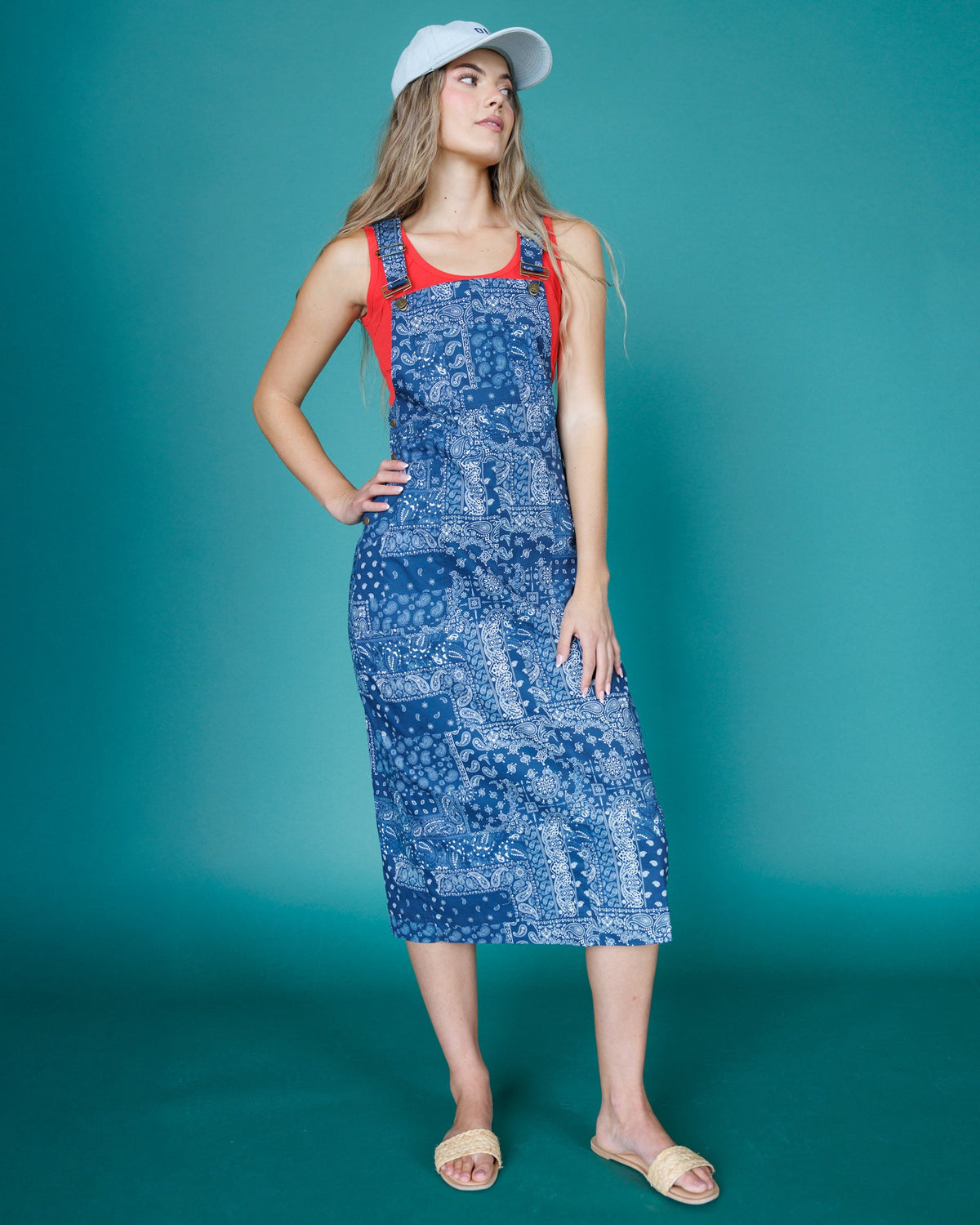 Downeast OOTD overalls dress with adjustable straps and front pockets, styled with casual daytime fashion.