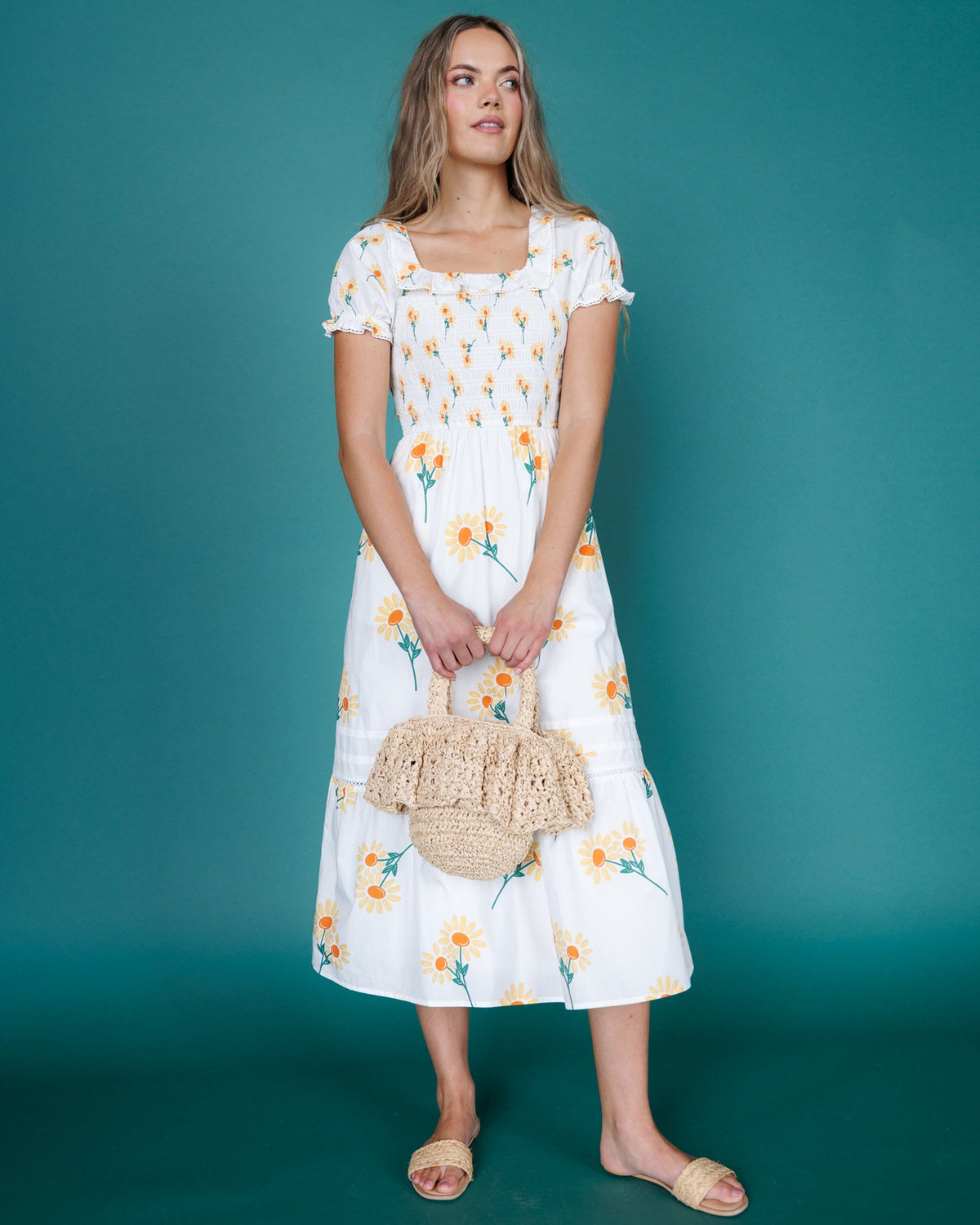 Downeast Arboretum Dress featuring floral pattern, sleeveless design, and flowing fabric ideal for spring and summer wear.