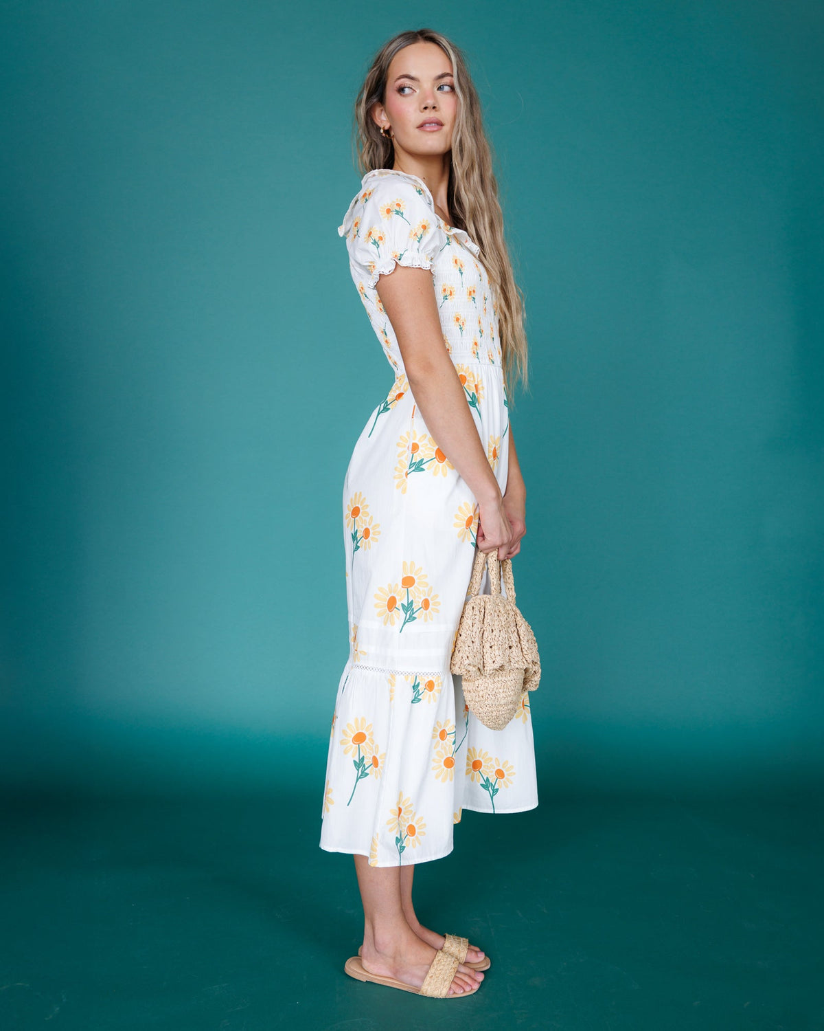 Downeast Arboretum Dress displayed on a hanger, featuring a floral pattern and lightweight fabric for a casual, elegant look.