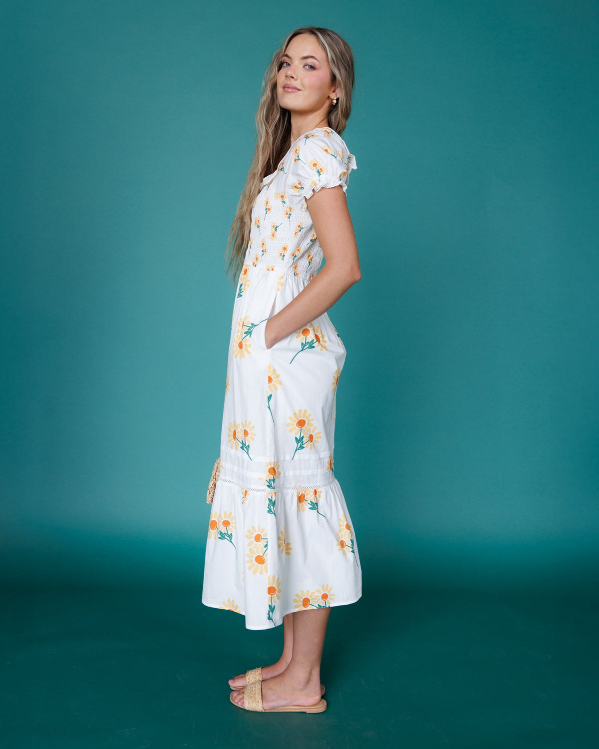 Downeast Arboretum Dress displayed on a hanger, featuring a floral pattern and lightweight fabric suitable for casual wear.