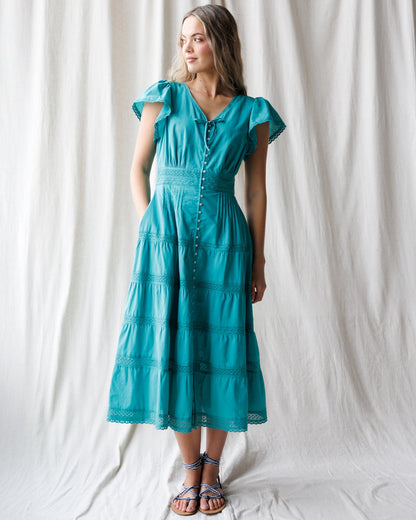 Downeast heirloom dress featuring intricate embroidery and vintage-inspired design, displayed on a mannequin.