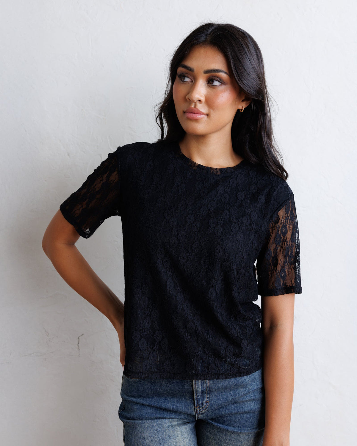Downeast Laid Back Lace Tee top, lightweight casual blouse with lace details, shown on a hanger.