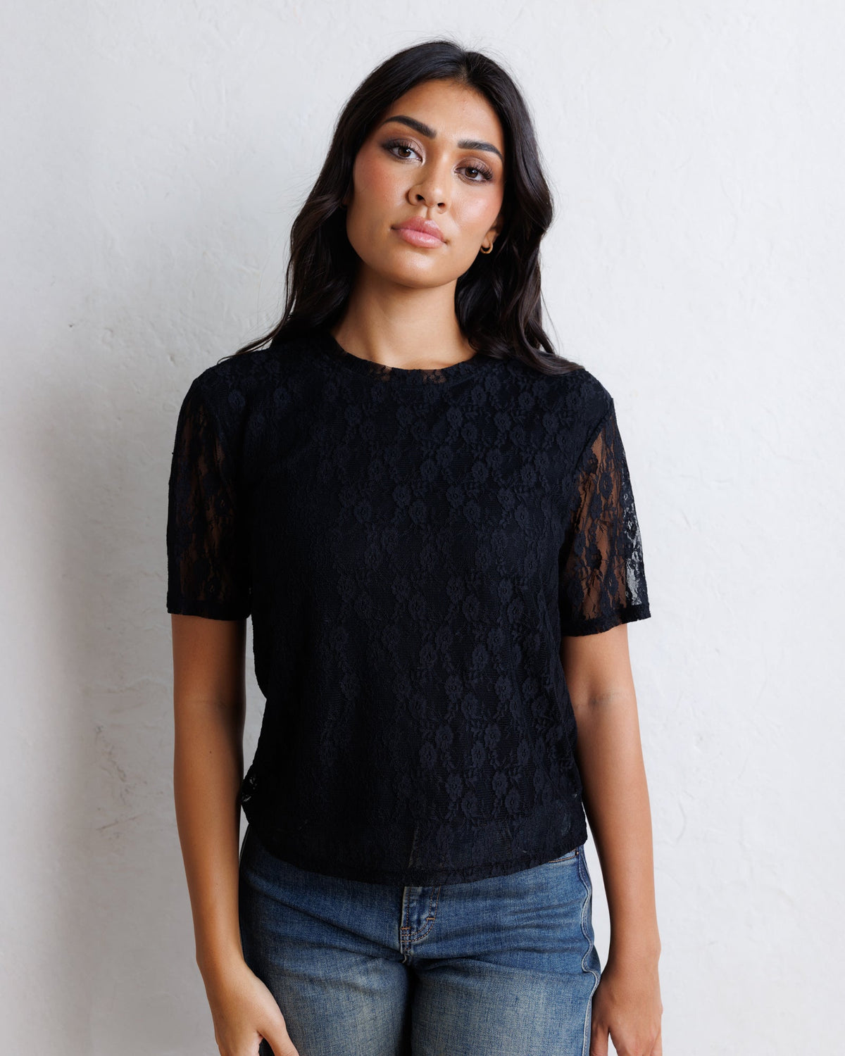 Downeast Laid Back Lace Tee top featuring soft fabric and lace details, shown on a hanger.