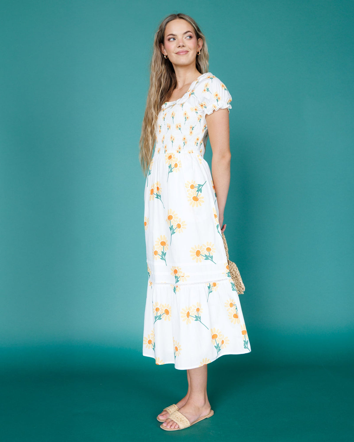 Downeast Arboretum Dress shown on a model, featuring a flowing fabric and floral print perfect for casual or semi-formal occasions.