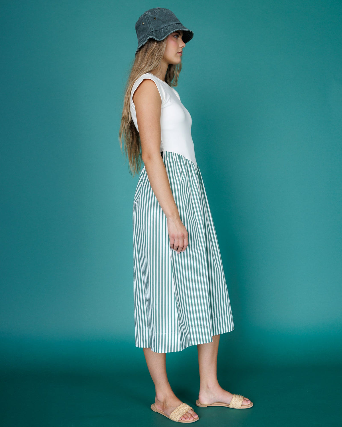 Downeast Valencia Dress shown on a hanger with floral pattern and flowing fabric, perfect for casual or summer wear.