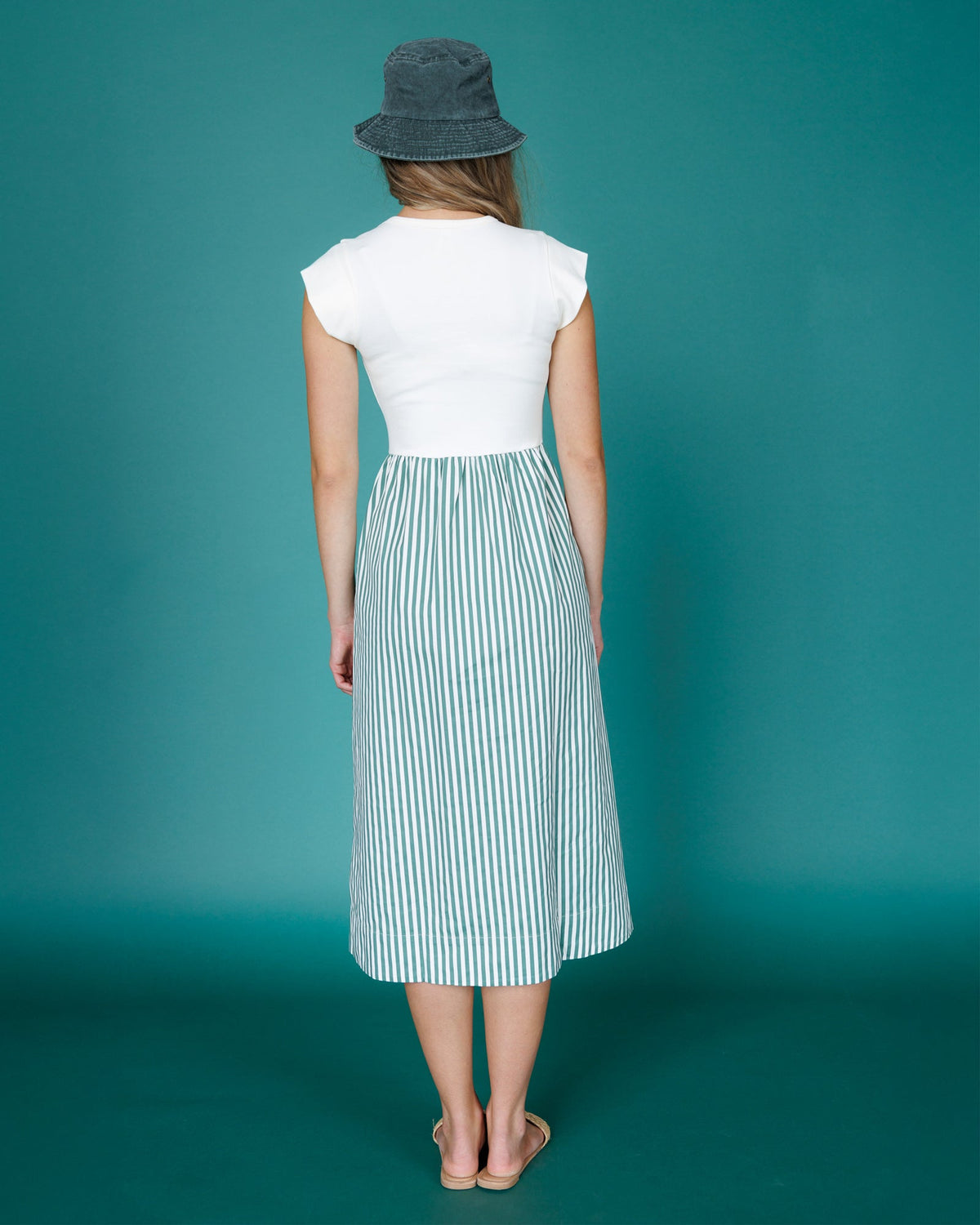 Downeast Valencia Dress with floral pattern, lightweight fabric, and sleeveless design perfect for summer wear.