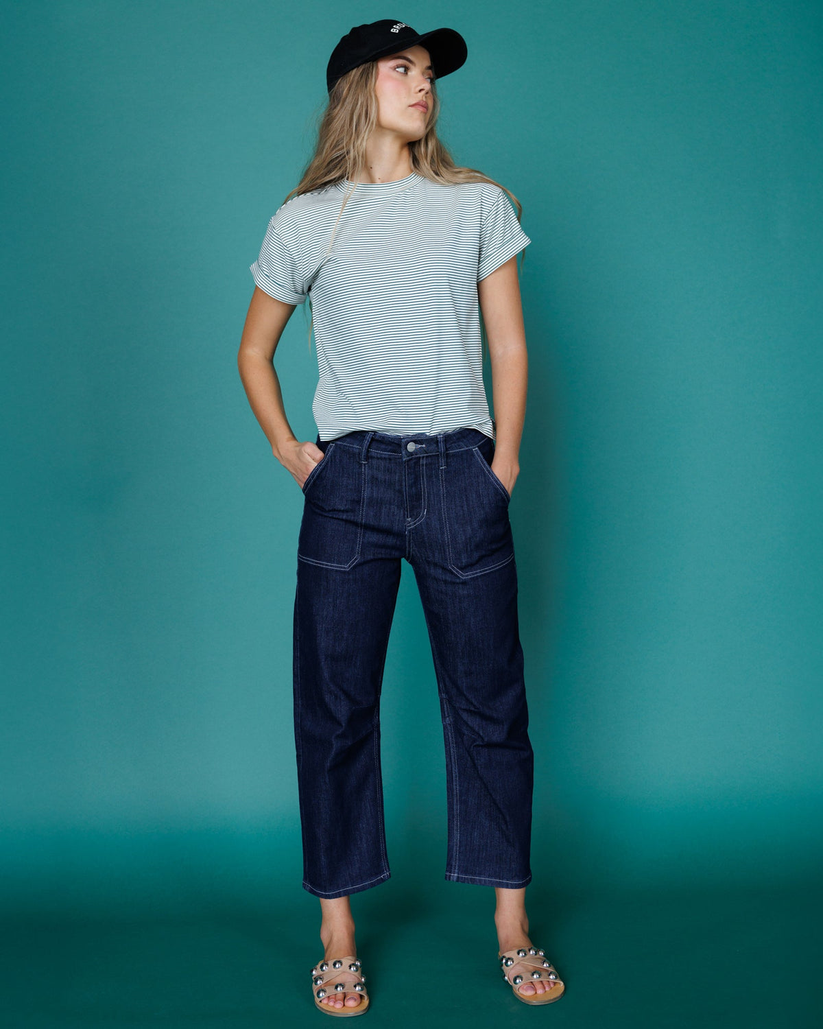 Downeast super high rise barrel-leg denim jeans displayed on a model, showcasing the relaxed fit and stylish design.
